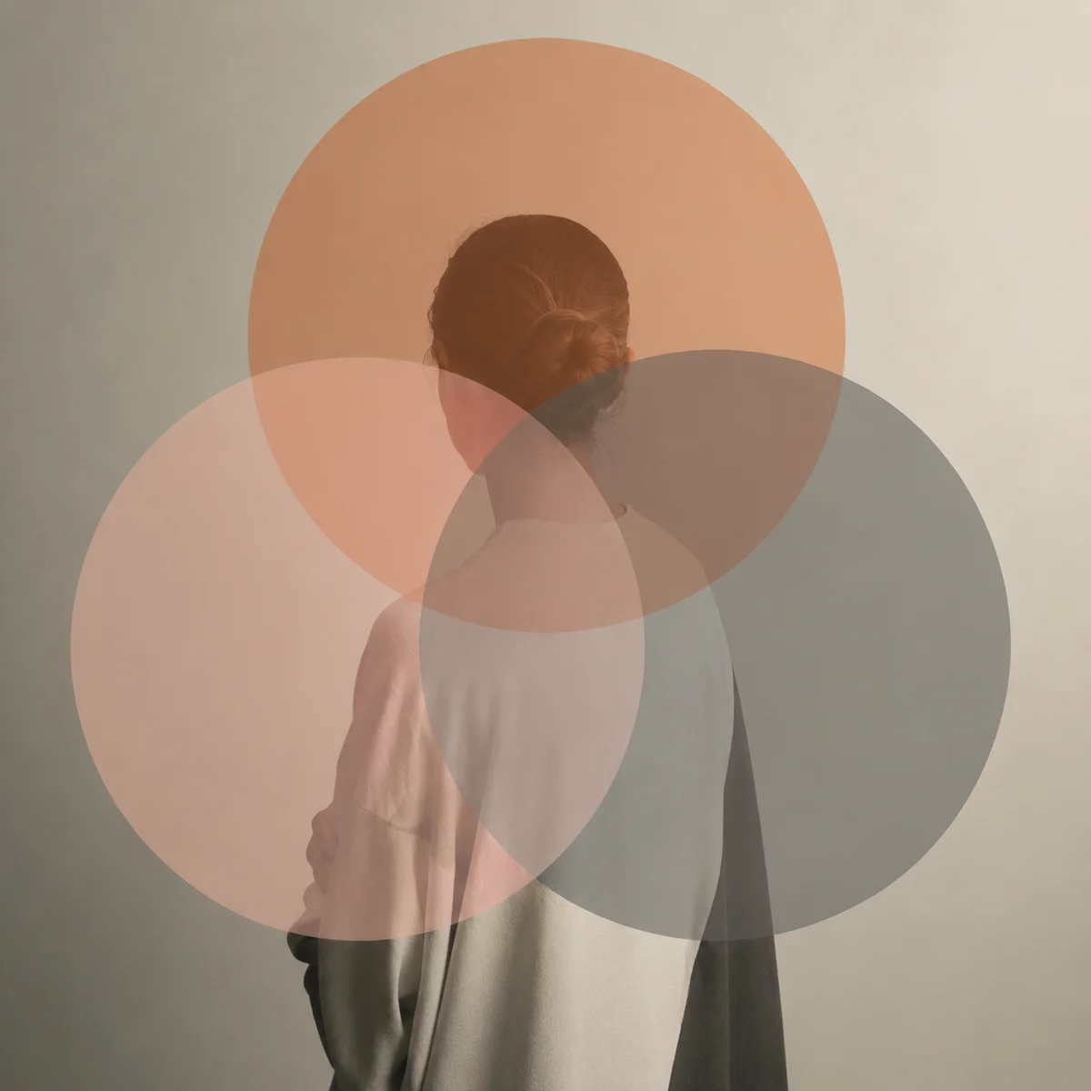 Three overlapping translucent circles in peach, blush and warm gray tones representing boundaries and connection