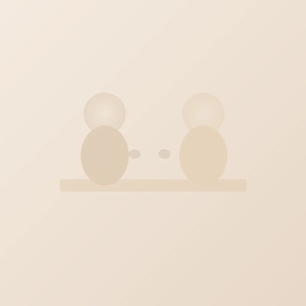 Two people talking over coffee at a kitchen table in morning light