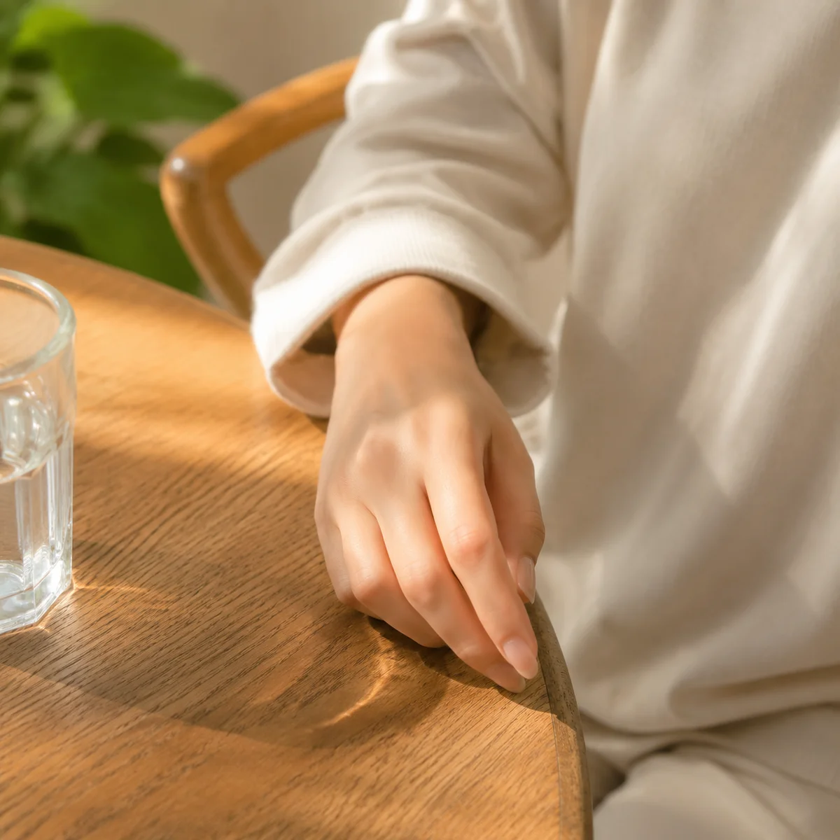 A hand resting calmly on a table representing a steady boundary
